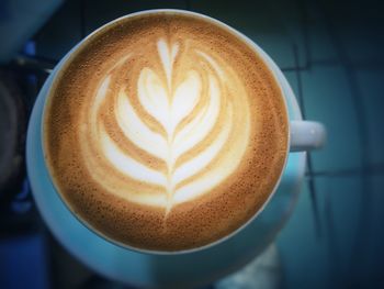 Close-up of cappuccino on table