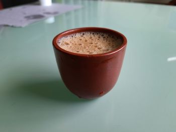 High angle view of coffee cup on table