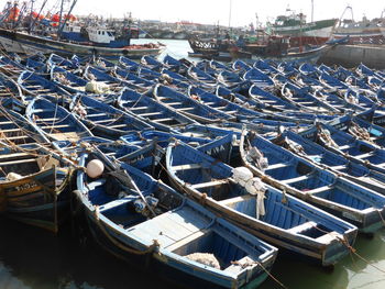 High angle view of boats moored at harbor