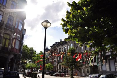 Street light in city against sky