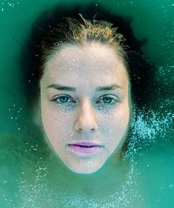 Portrait of young woman in swimming pool