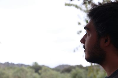 Side view of man against sky