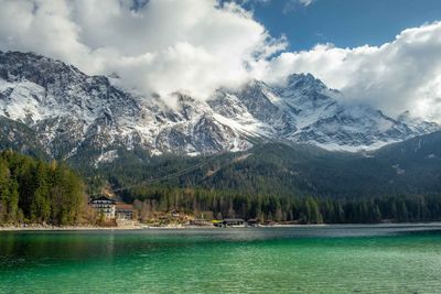 View of eibsee lake, bavarian alps, during winter. snowy mountains as background.