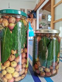 Close-up of fruits in glass jar on table