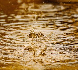 Close-up of water splashing on lake