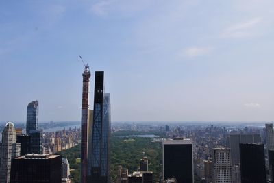 Modern buildings in city against sky