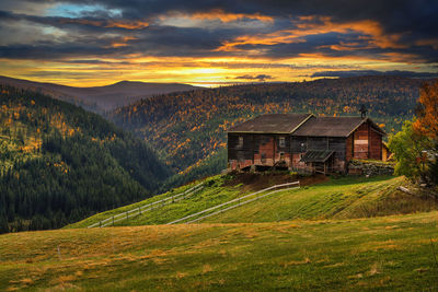 Scenic view of field against sky during sunset