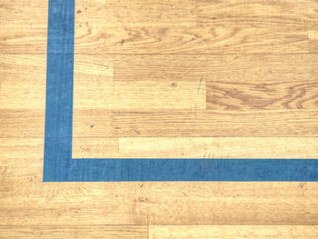 Black lines with wooden planks distress overlay. black corner. worn out wooden floor of sports hall