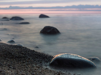 Scenic view of sea against sky at sunset