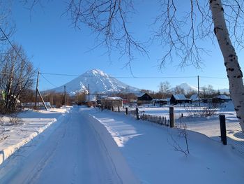 Scenic view of snow covered mountains against sky