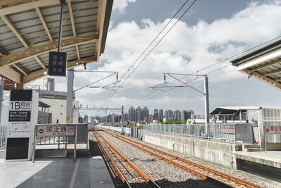 Railroad station platform against sky