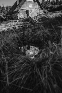 Abandoned building by lake