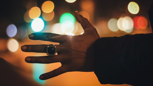 Close-up of hand holding cigarette