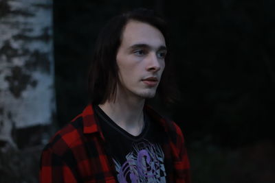 Portrait of young man looking away