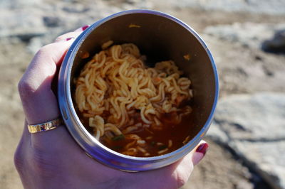 Close-up of hand holding soup