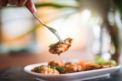 Close-up of hand holding food