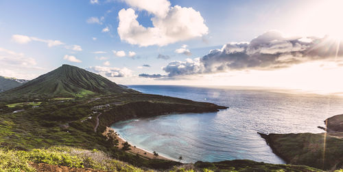 Scenic view of calm sea against cloudy sky