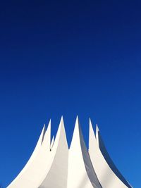 Low angle view of building against clear blue sky