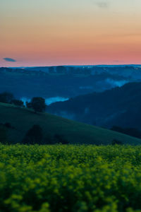 Scenic view of landscape against sky during sunset