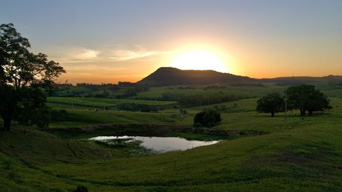 Scenic view of landscape against sky during sunset