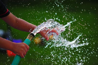 Close-up of hand holding water