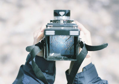 Close-up of hand holding camera