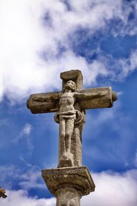 Low angle view of statue against sky