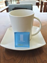 Close-up of coffee cup on table