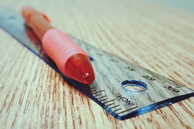 Close-up of pen and ruler on table