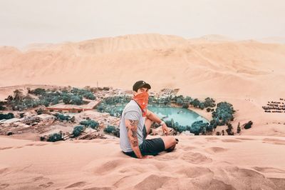 Man sitting on desert