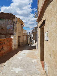 Footpath amidst buildings in town