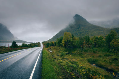 Road amidst mountains against sky