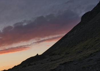 Scenic view of mountains against sky at sunset