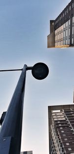 Low angle view of street light against sky