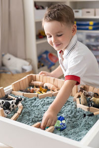 Boy eating food at home