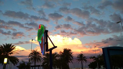 Low angle view of palm trees against sky