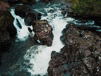 High angle view of rocks in sea