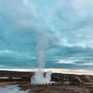 Panoramic view of people on landscape against sky