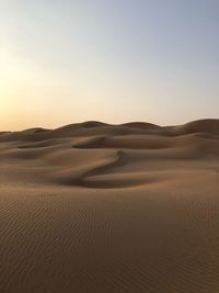 Scenic view of desert against clear sky