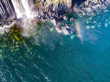 High angle view of waterfall in sea