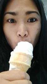 Portrait of mid adult woman holding ice cream