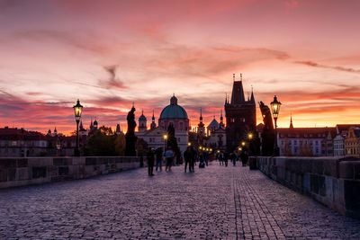 View of buildings in city during sunset