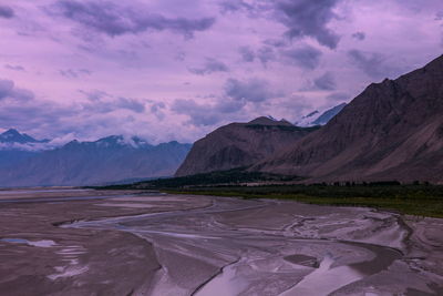 Scenic view of mountains against sky during sunset