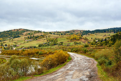 View of dirt road through landscape