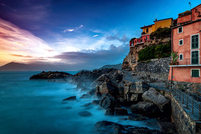 Panoramic view of sea and buildings against sky