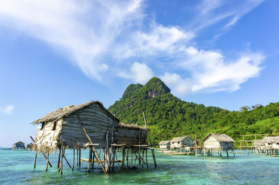 Scenic view of sea and building against sky