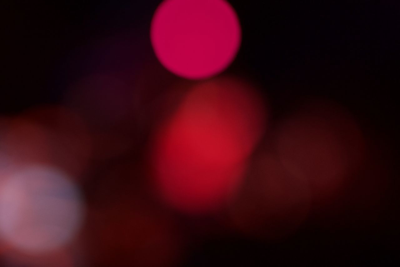 DEFOCUSED IMAGE OF LIGHTS AT NIGHT