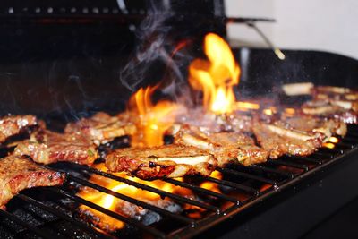 Close-up of meat on barbecue grill