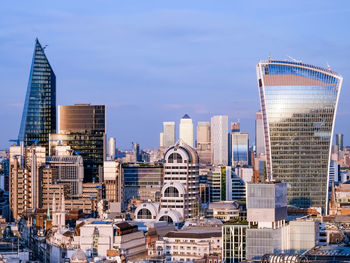 Modern buildings in city against sky