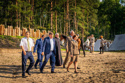 Group of people walking on road